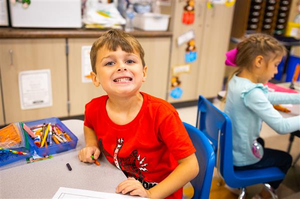 Students inside their classrooms learning. 